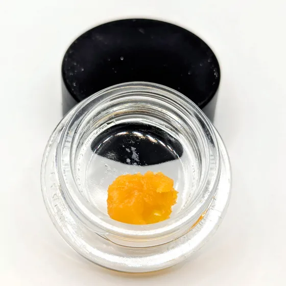 Hella Jelly Fire Bug sugar wax in an open glass jar